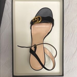 Gucci Marmont leather GG block heel sandals.